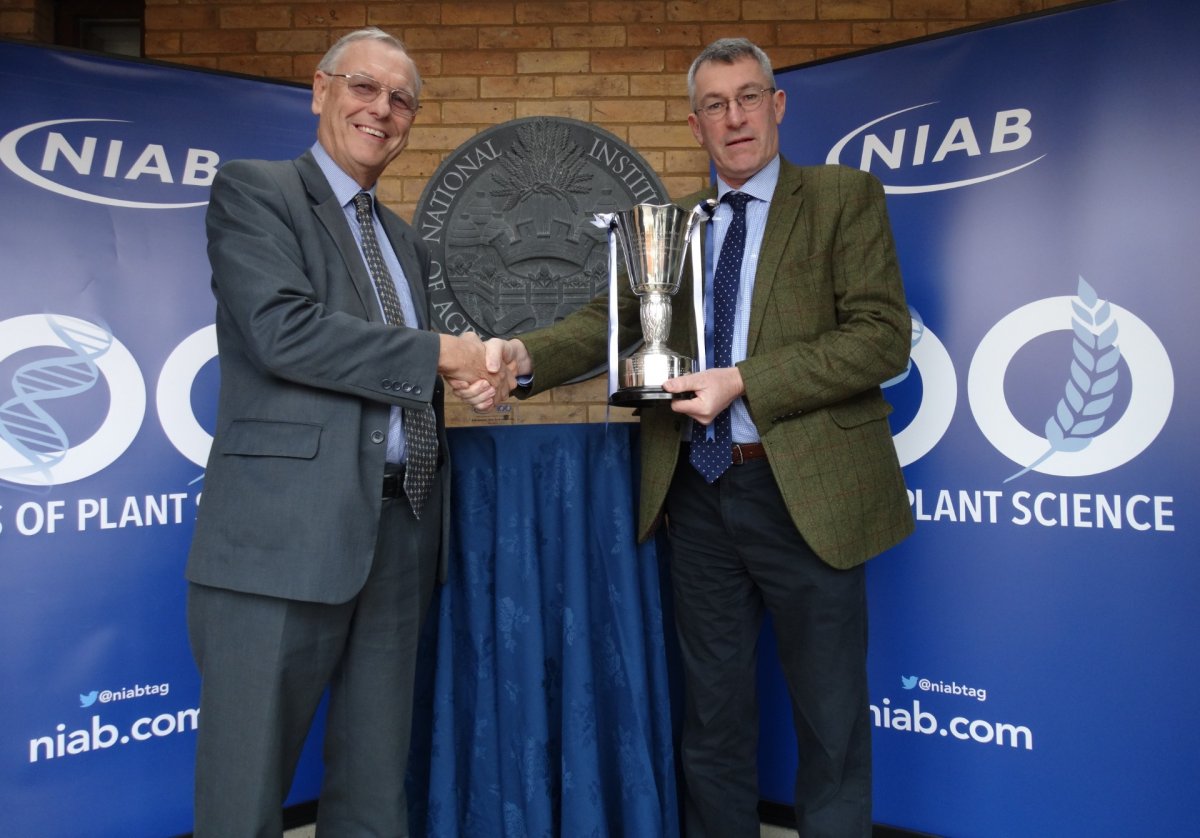 NIAB chairman Jim Godfrey awards the NIAB Centenary Variety Cup to Elsoms' Robin Wood, for the red onion variety Red Baron