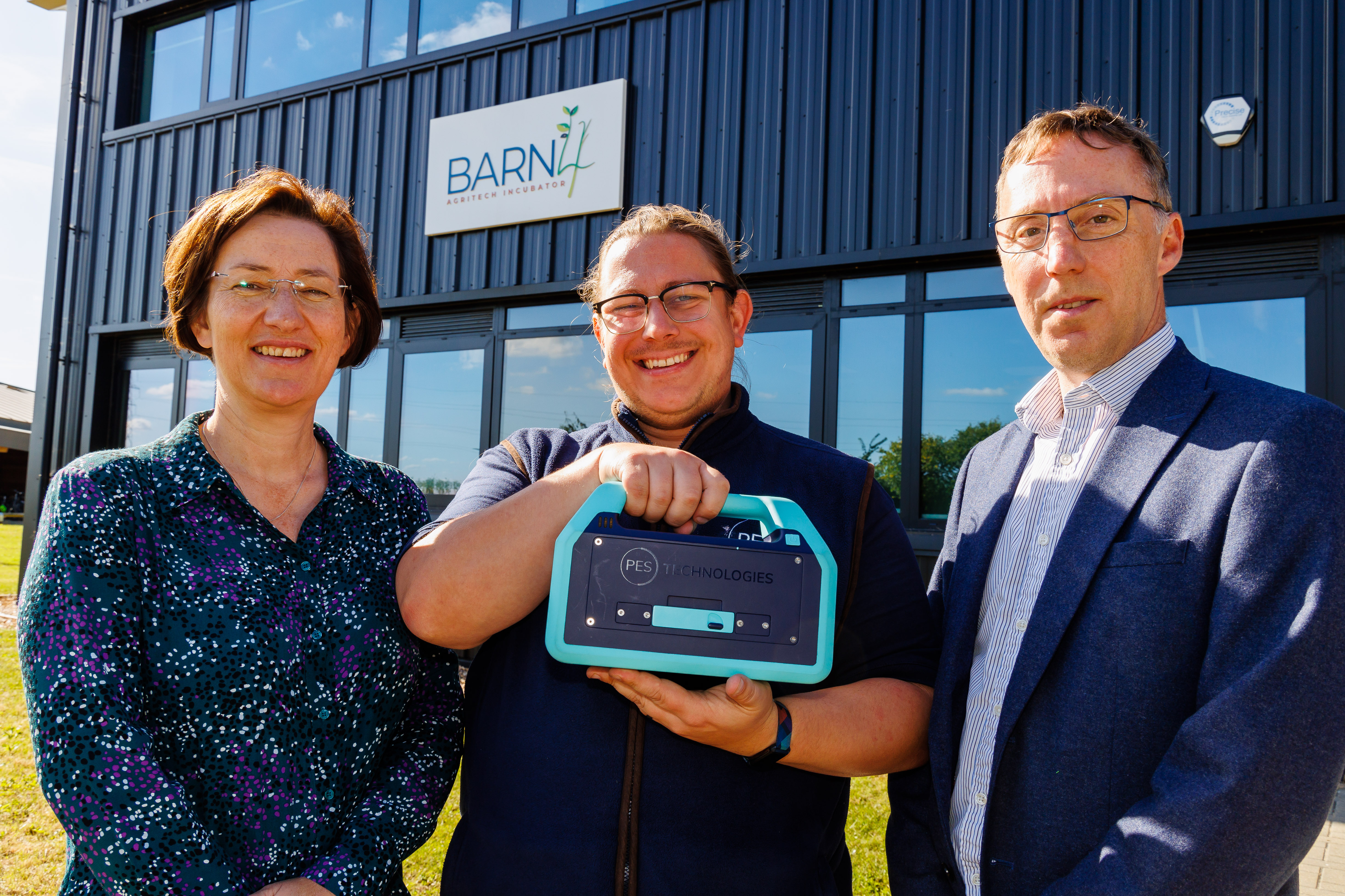 Emma Garfield, agri-tech specialist on the Cambridgeshire & Peterbrough Business Board, Andrej Porovic of PES Technology with a soil health monitoring tool and Dr Michael Gifford, Director of Commercialisation NIAB