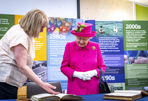 Dr Tina Barsby shows HM The Queen archive images from NIAB Huntingdon Road opening